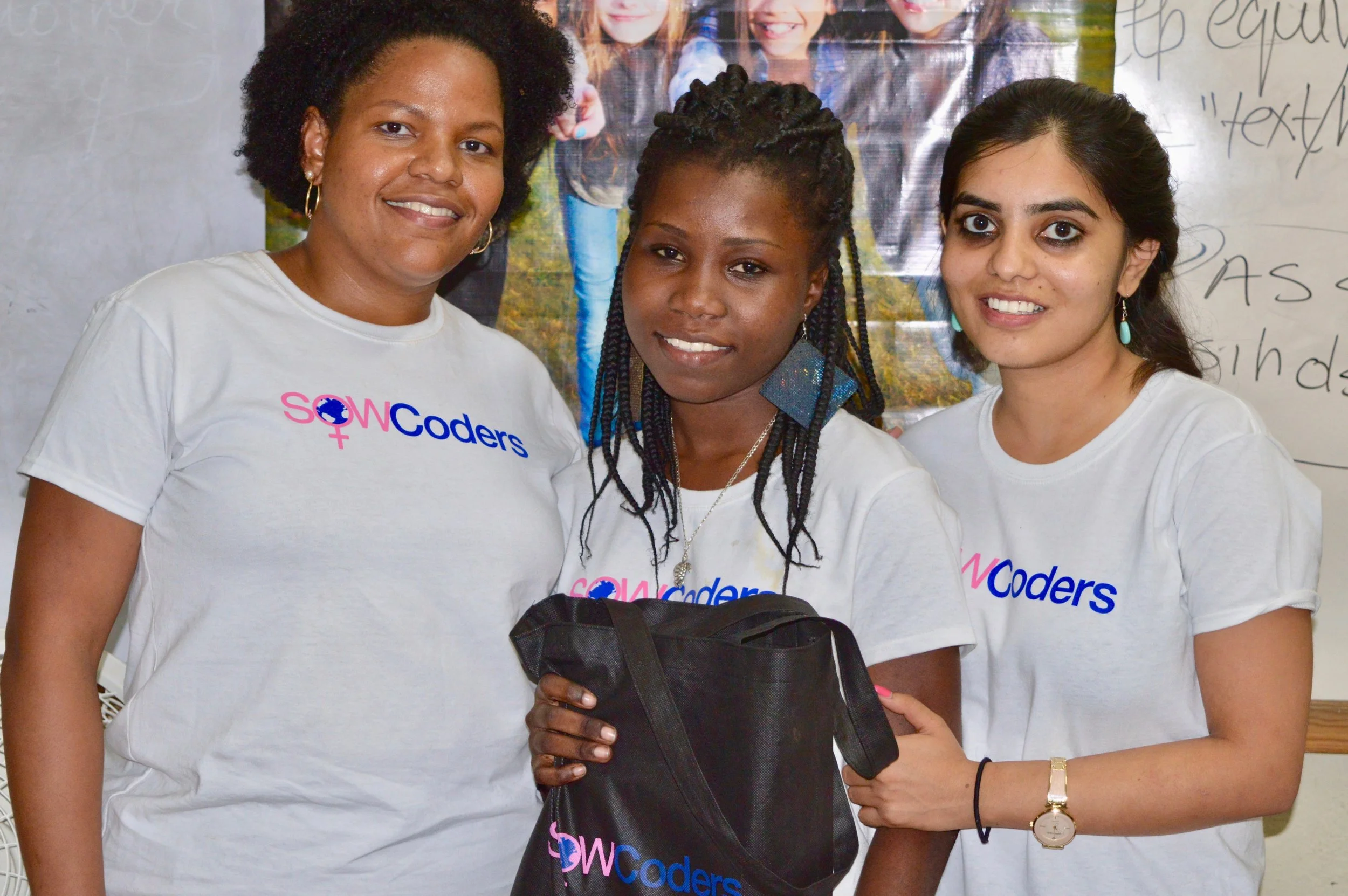 Farah Laurore, Belenda (Best Learner of the cohort), and Kavya Krishna at a laptop award ceremony